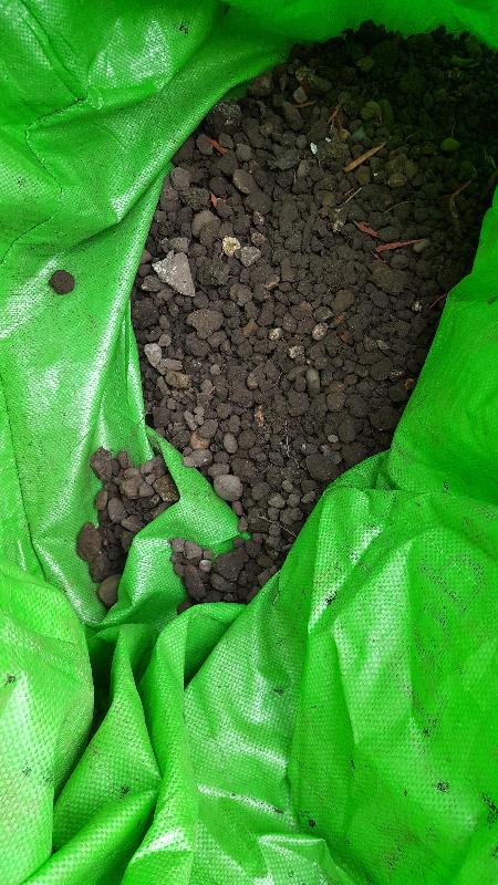 "Screened Topsoil" full of stones, glass and even the end of a pair of scissors!