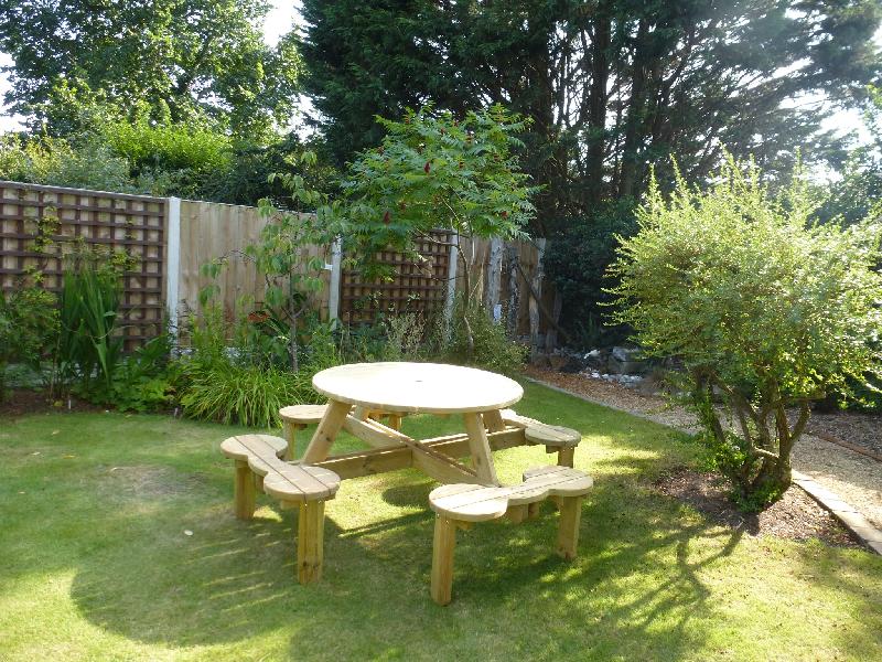 A good, nice looking picnic table.