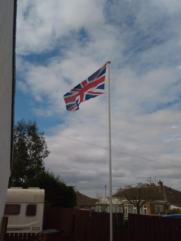 Top flag pole