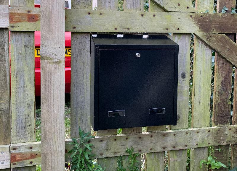 The fence might be tatty but the letterbox is ace!