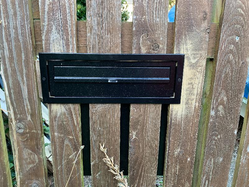 The fence might be tatty but the letterbox is ace!