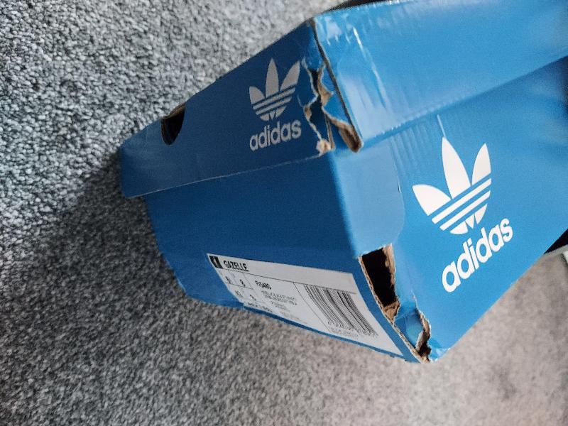 Trainers arrived and box was ripped and squashed.