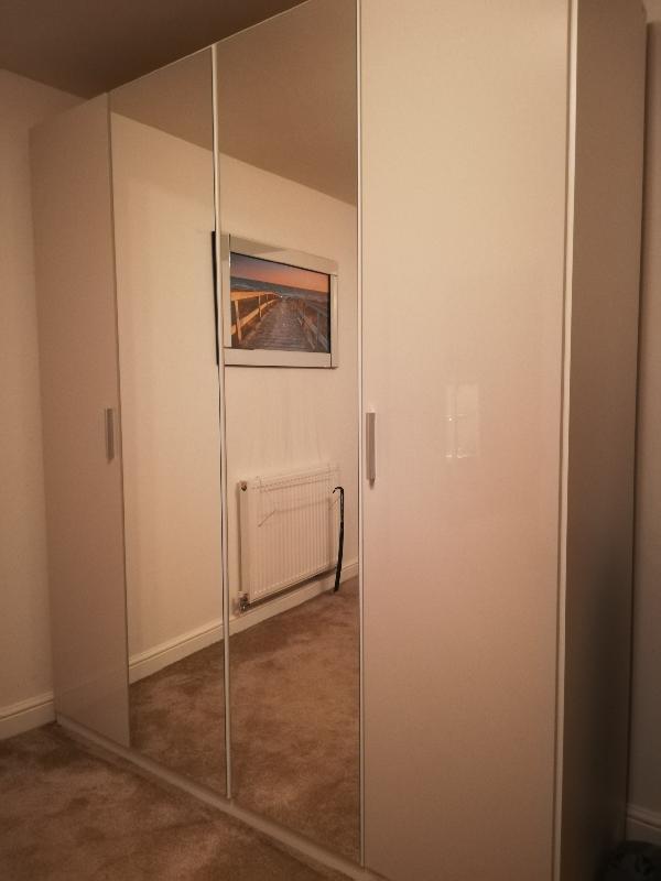 Four door hinged wardrobe.