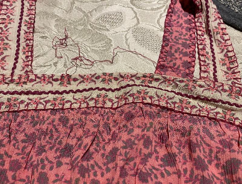 The embroidery on the dress was falling apart.