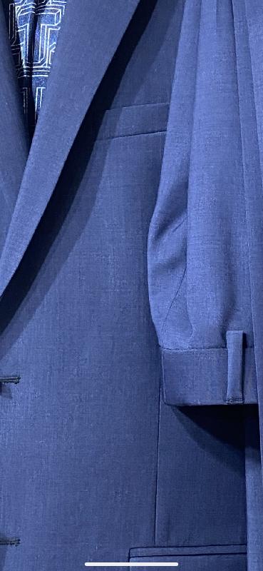 Different colour material used in trousers and jacket