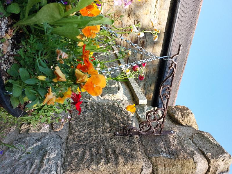 Sturdy and aged-bronze brackets