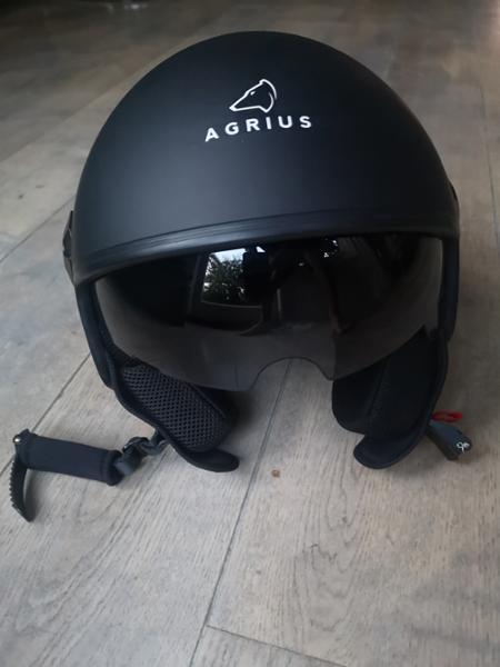 Open face helmet with internal visor.
