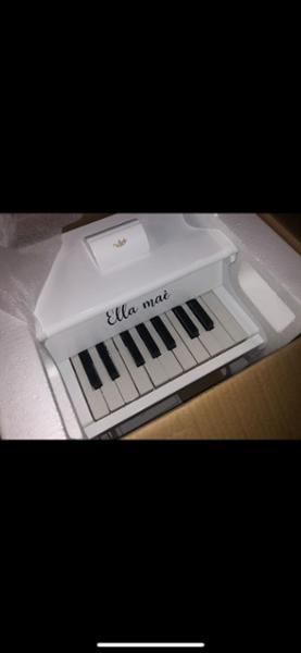 White personalised wooden piano
