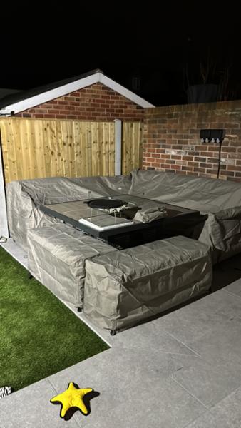 Corner patio set with fire and parasol with lights