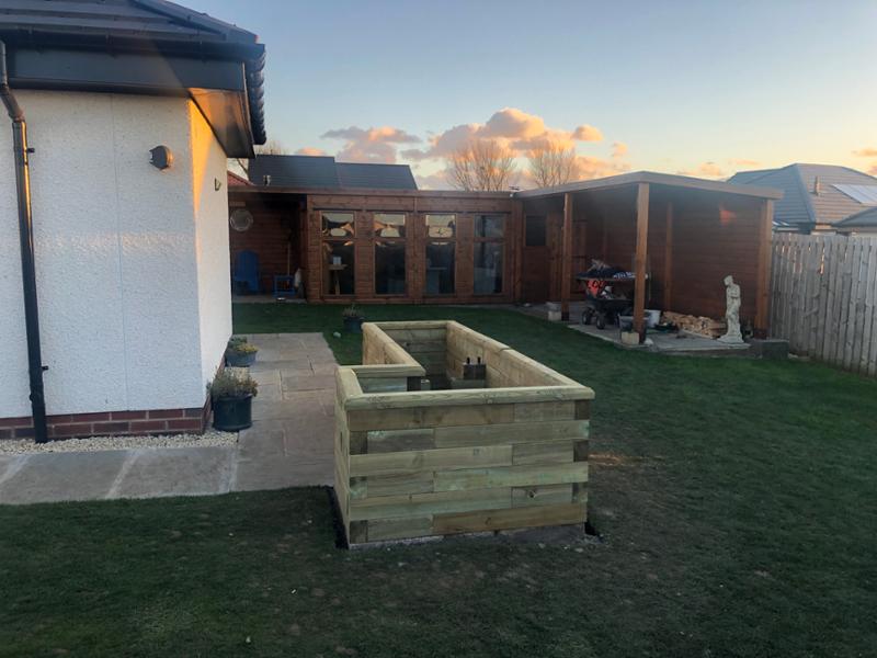 L shaped raised bed A bit of ground work was needed to level off