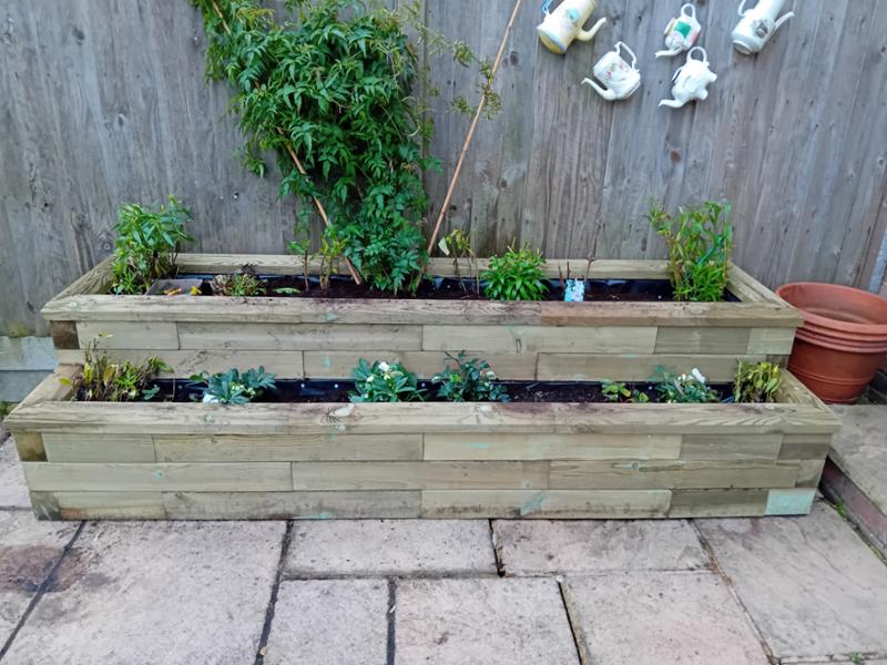 Messy pot-filled patio transformed.