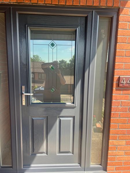 Anthracite on white A-rated windows, sliding patio door & front Solidor with side panels