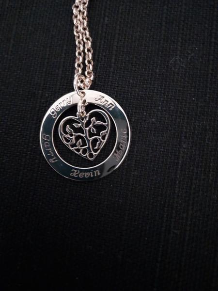 Tree of life 9ct gold pendant with family names engraved on it.