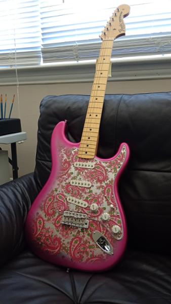 Pink fender and guitar guitar