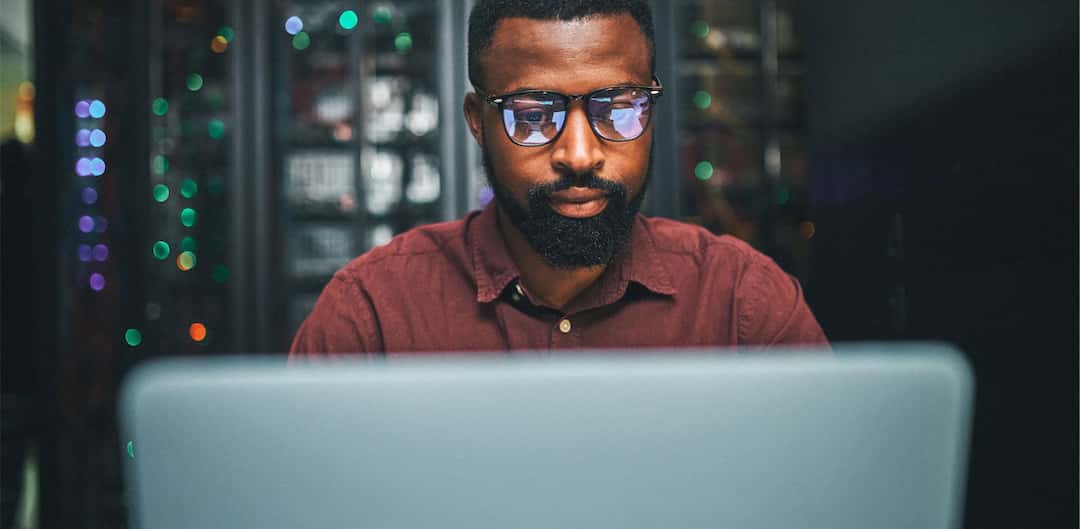 black-man-looking-at-computer-at-night.jpg